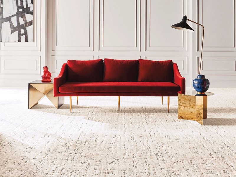 red sofa on a white carpet from U Payless Flooring in Schumacher